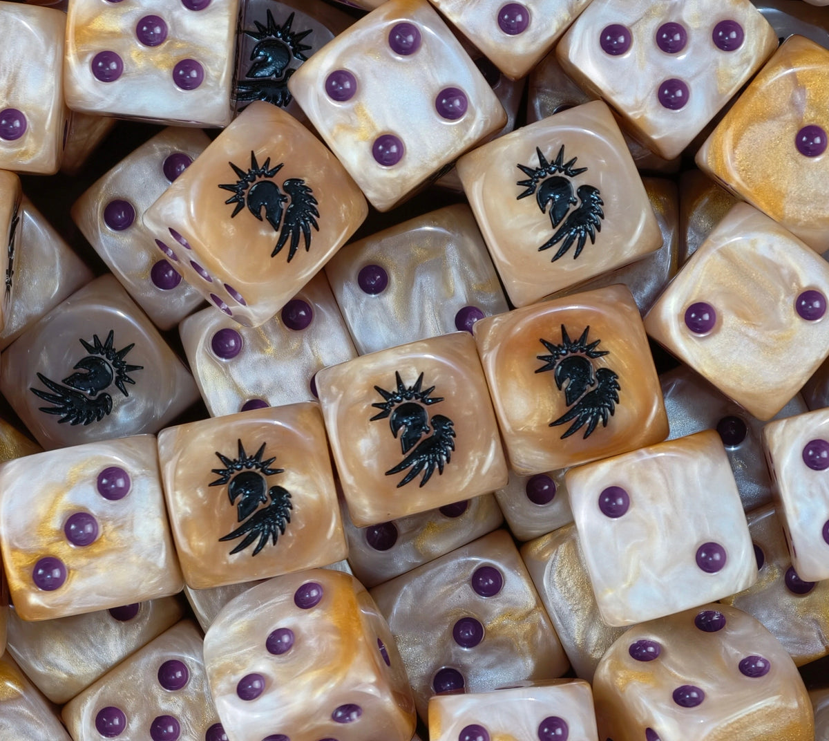 A pile of gold Sons of the Phoenix D6 with violet pips and crests