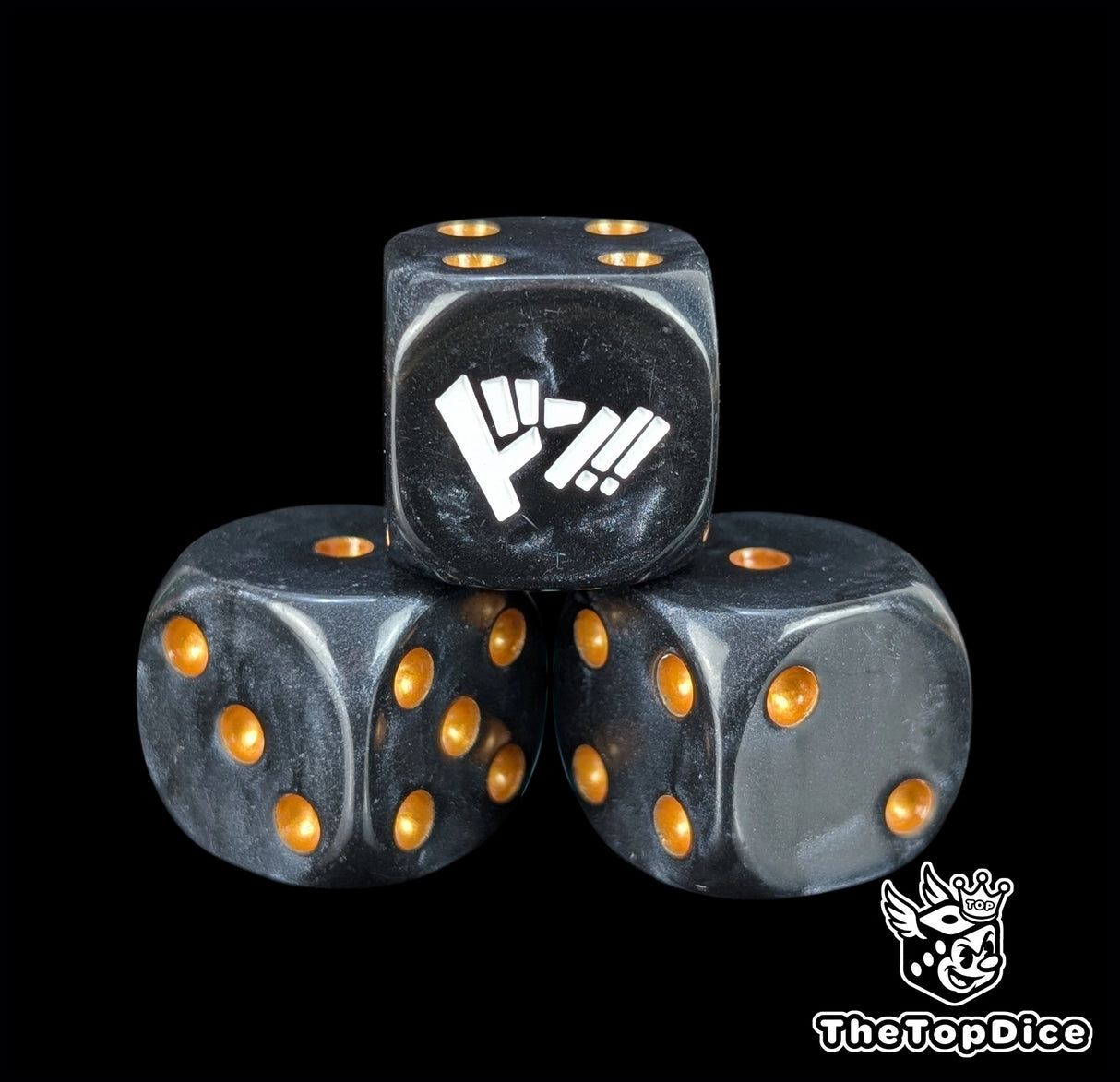 Close up of a black 16mm resin D6 die engraved with gold pips as a TCG power counter