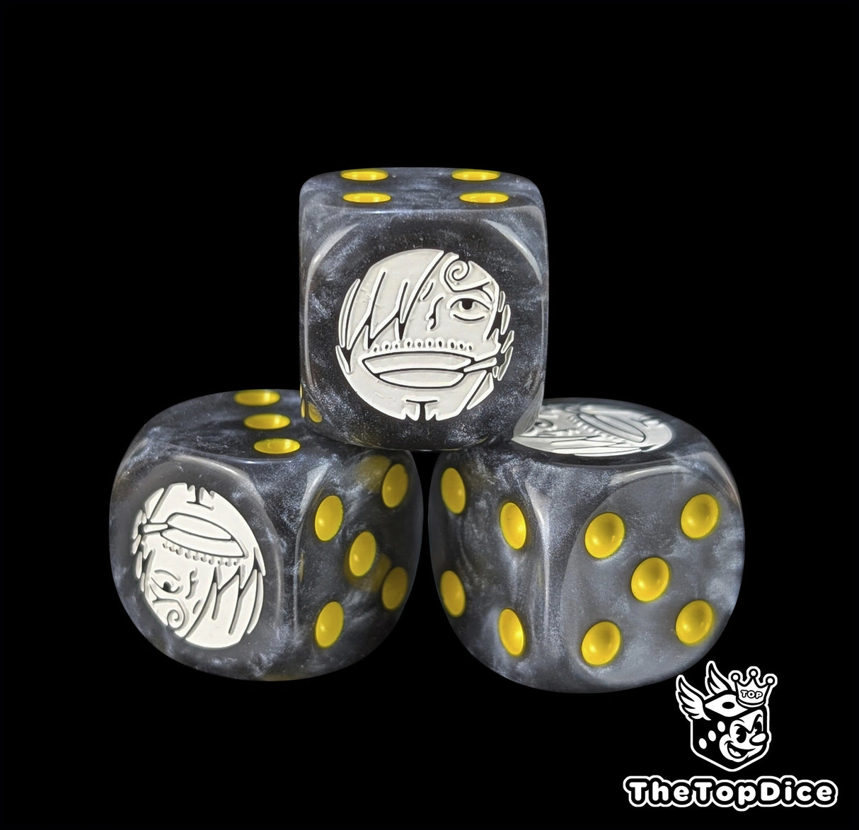 Close up of a black 16mm resin D6 die engraved with a white cook emblem and yellow pips