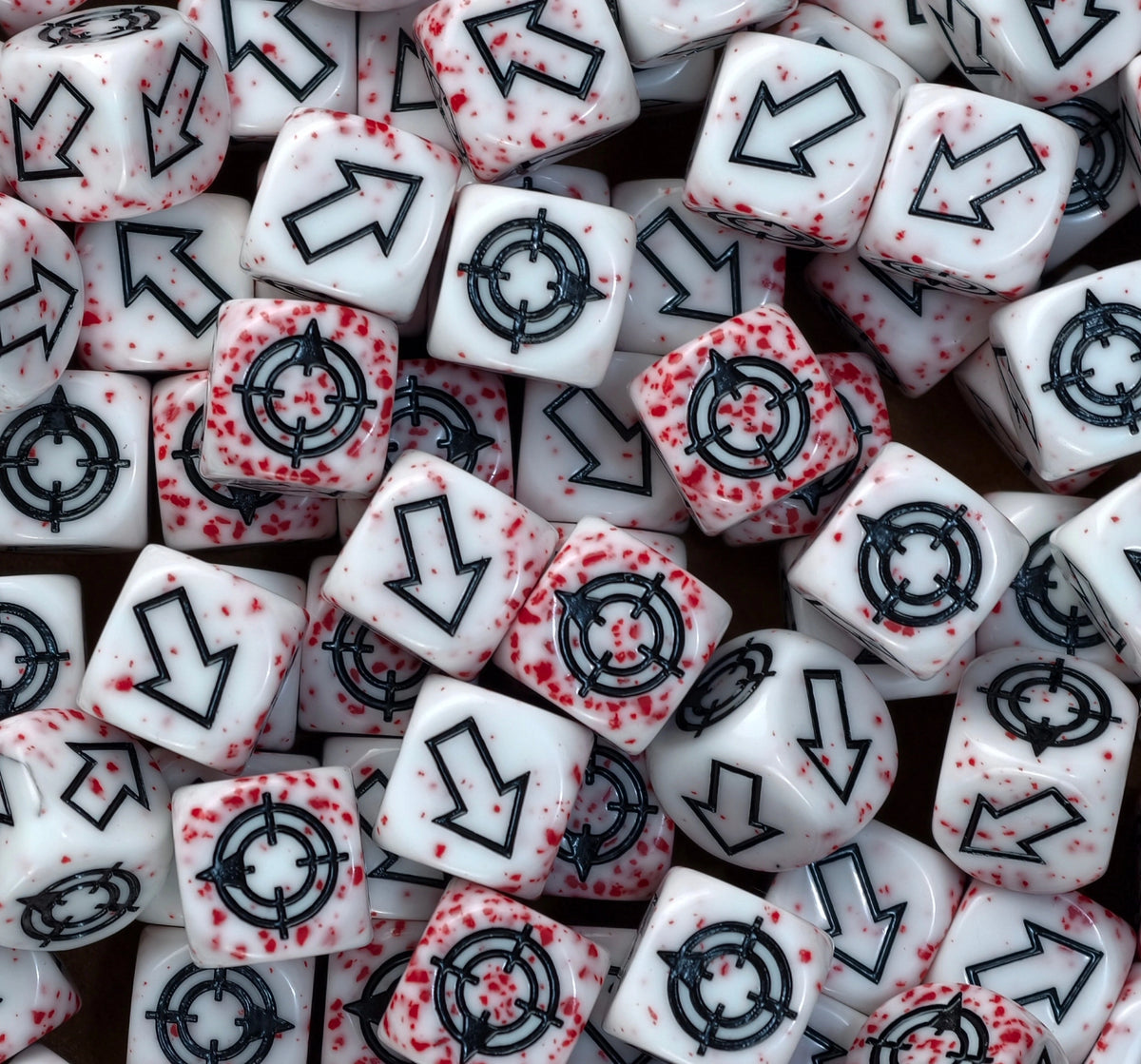 Bloodspatter dice heaped together, red speckling running right through the white resin