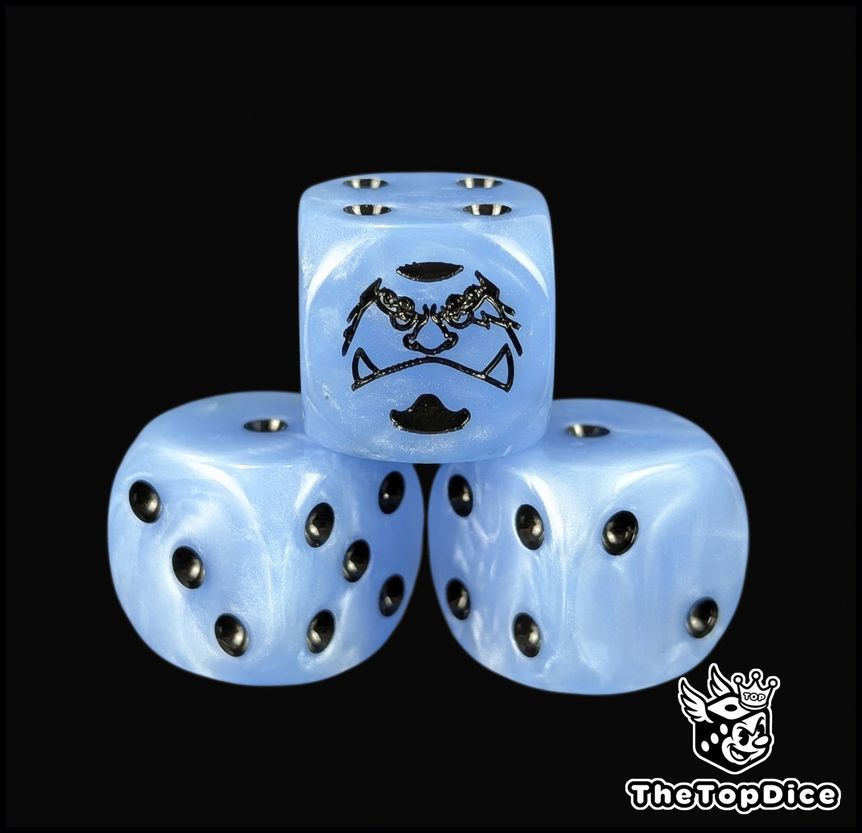 Close up of a blue 16mm resin D6 die engraved with a black warrior emblem and black pips
