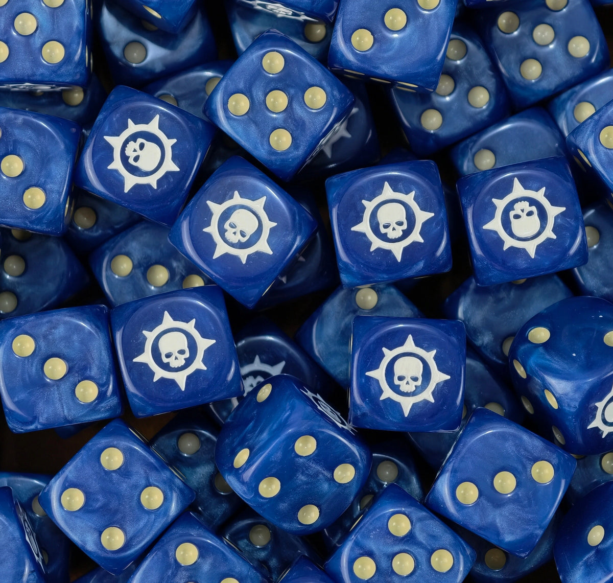 A pile of blue Badab War dice, white star skulls and gold pips repeating