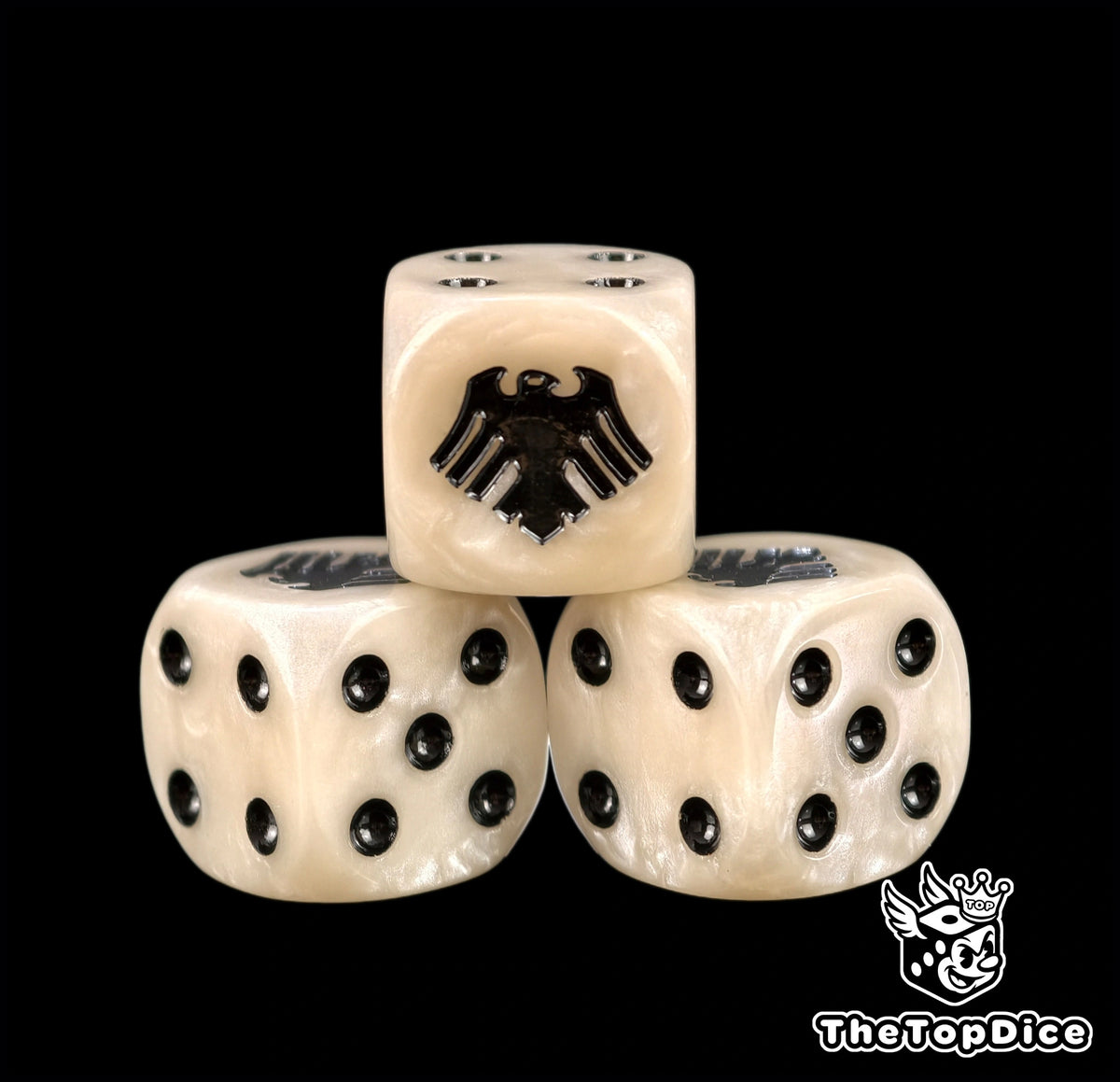 Three cream Raven Guard dice with a black raven and black pips