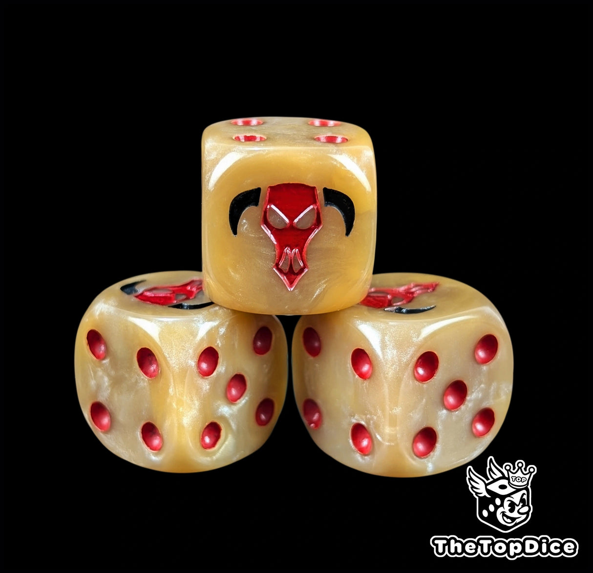 Close up of a bronze 16mm resin D6 die engraved with a red bull head and red pips