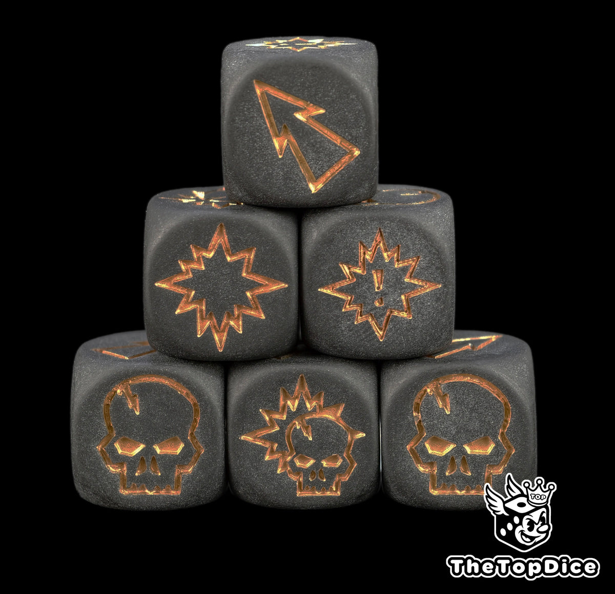 Six matte black Blood Bowl block dice stacked in a pyramid with bronze skull, pow and push symbols