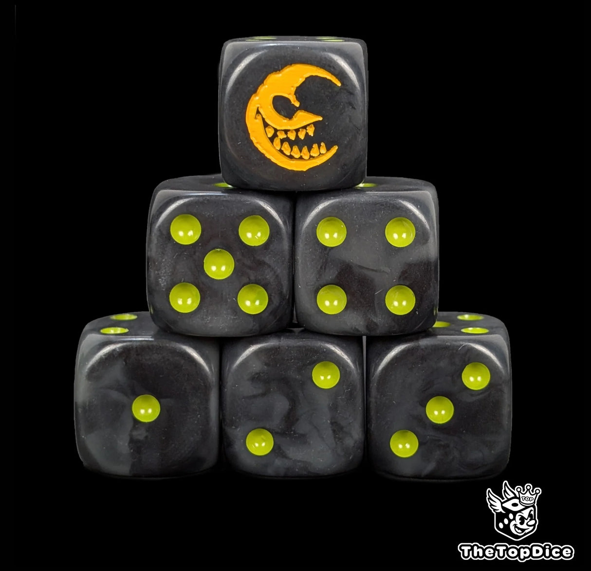 Black 16mm D6 dice with a yellow grinning moon emblem and green pips for fantasy wargaming