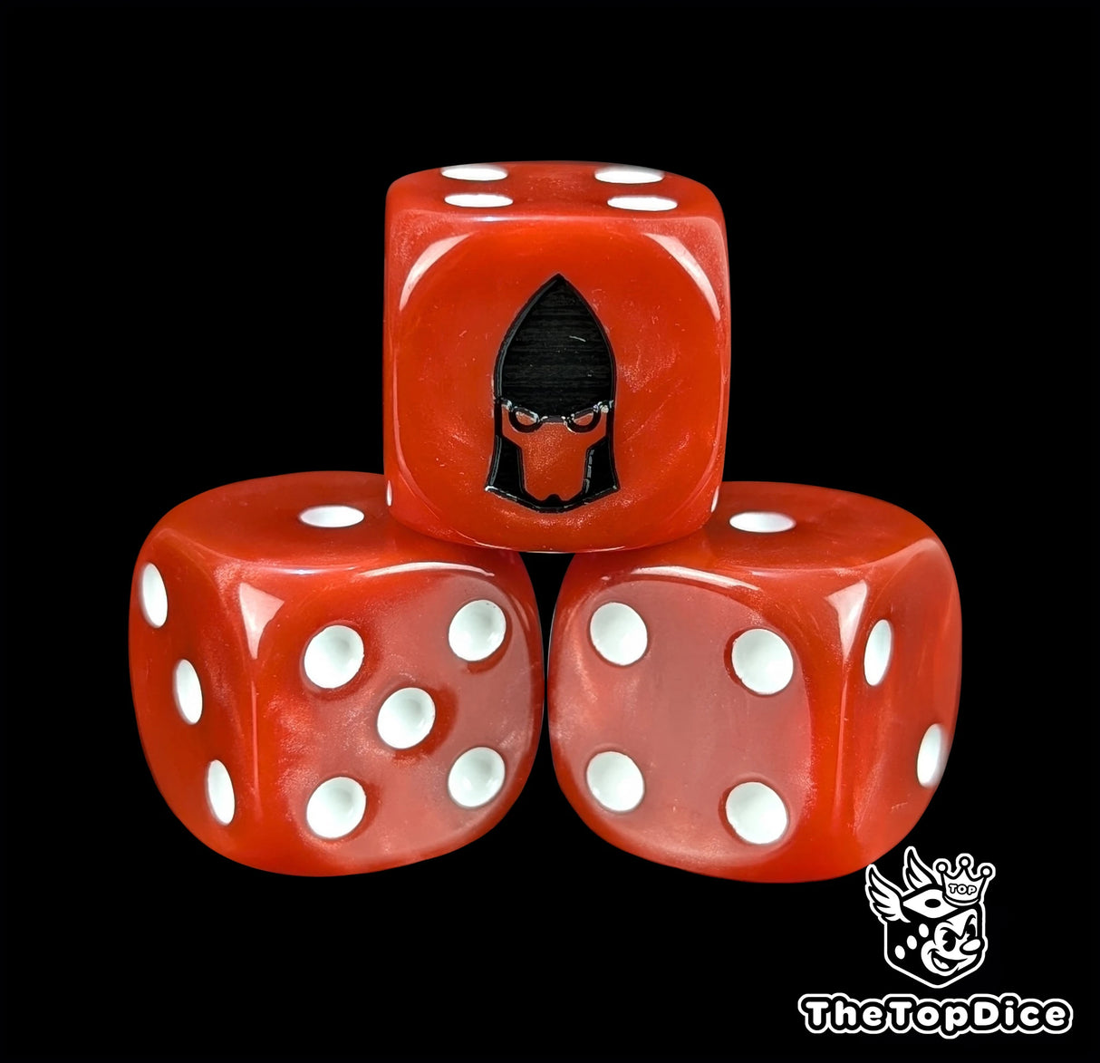 Close-up of a red D6 die with a black space elf profile