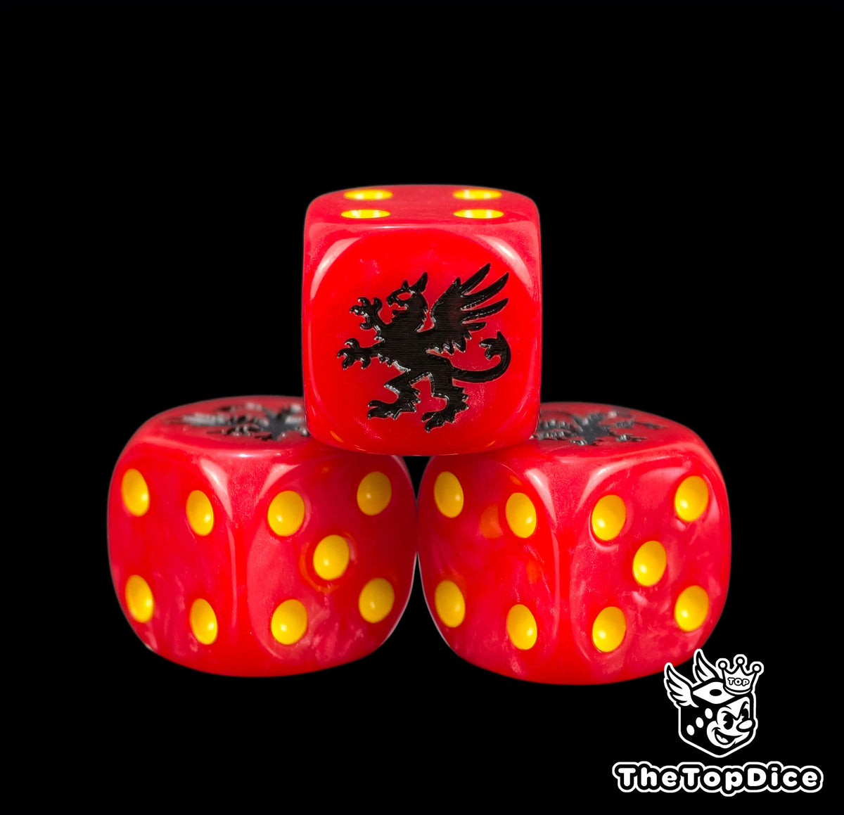 Three red chapter dice with a black rearing griffon on top