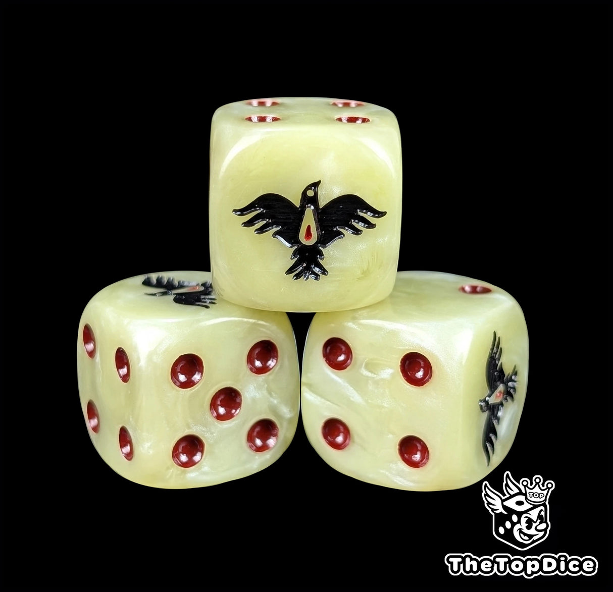 Close-up of a beige D6 die with a black raven and red blood drop