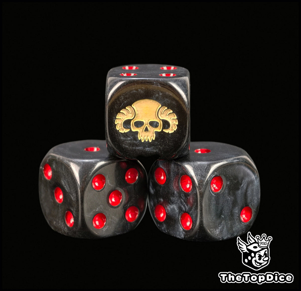 Close view of the bone horned skull engraved on a black 16mm D6 with red pips