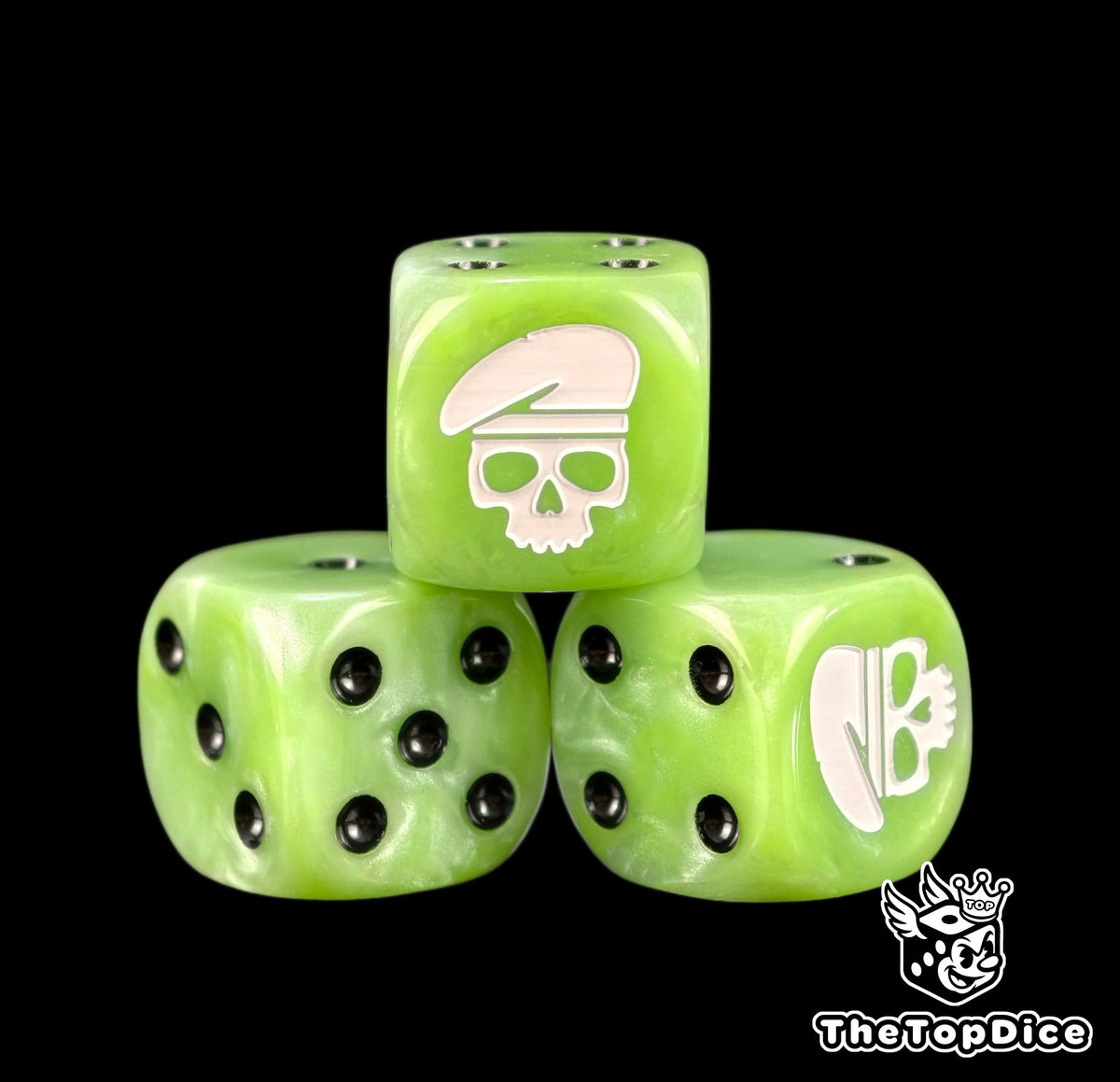 Three lime green Ratling dice with a white skull wearing a beret