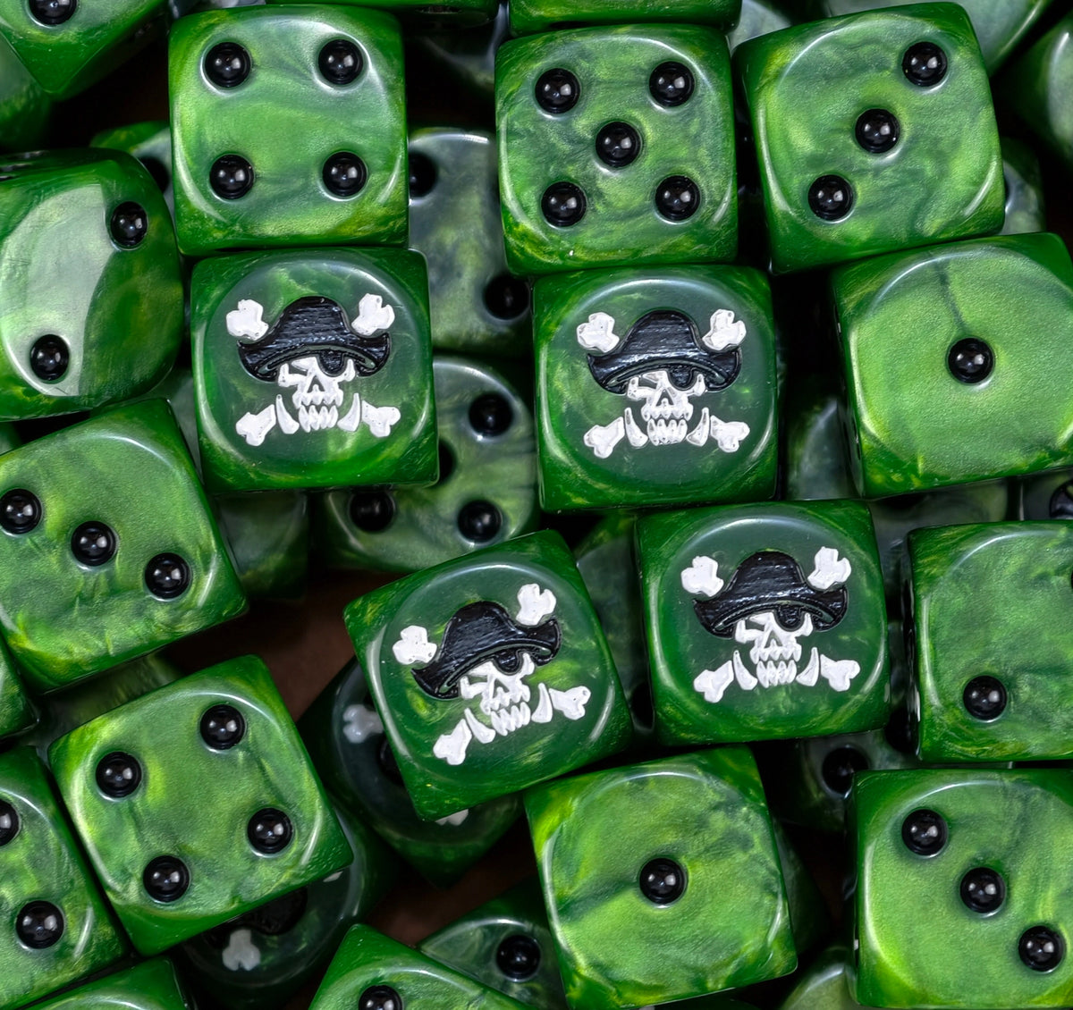 A pile of green ork pirate D6 with white skulls in pirate hats
