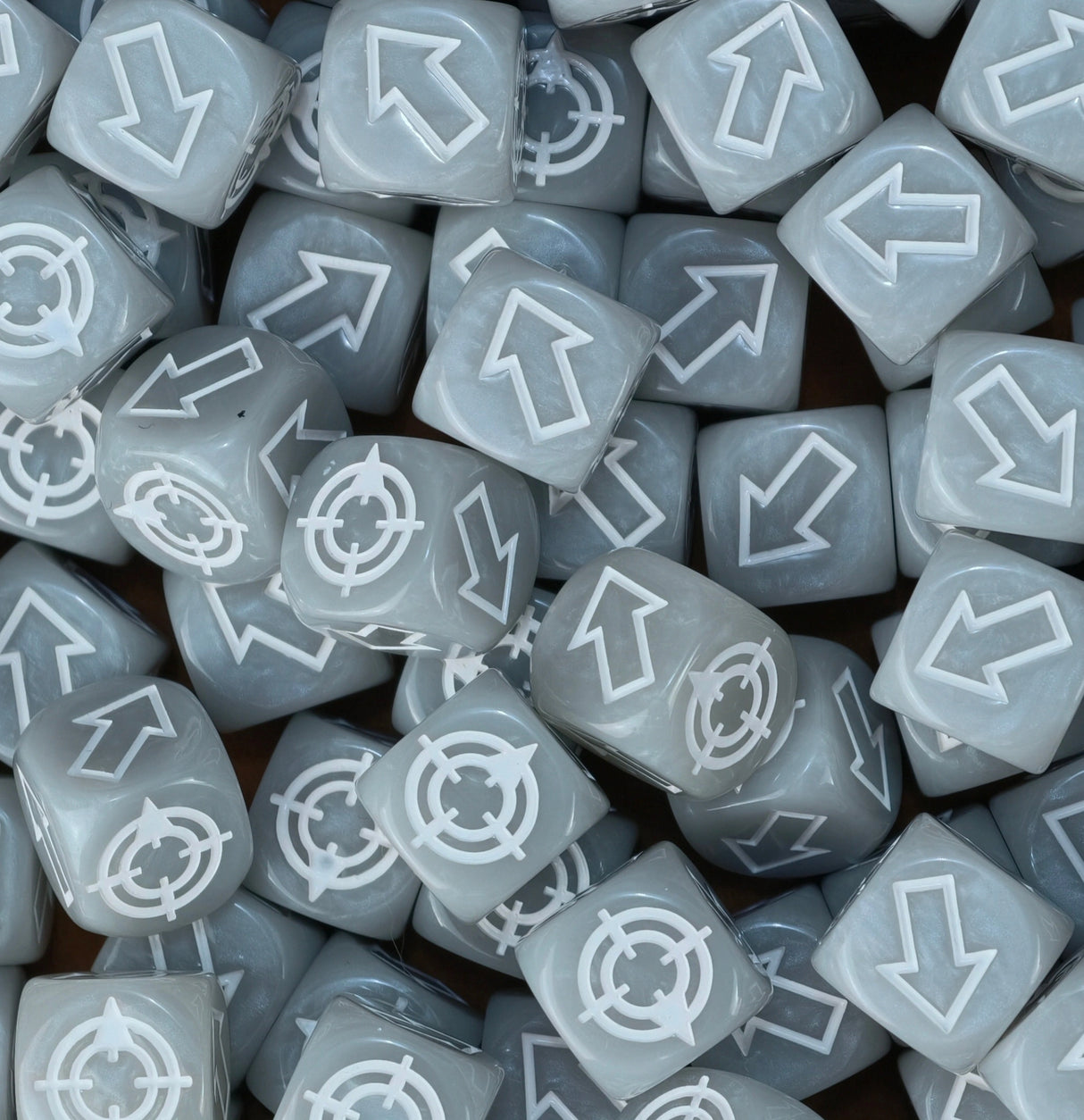 Grey and white scatter dice in a tray, matched to the ash waste boards of Necromunda