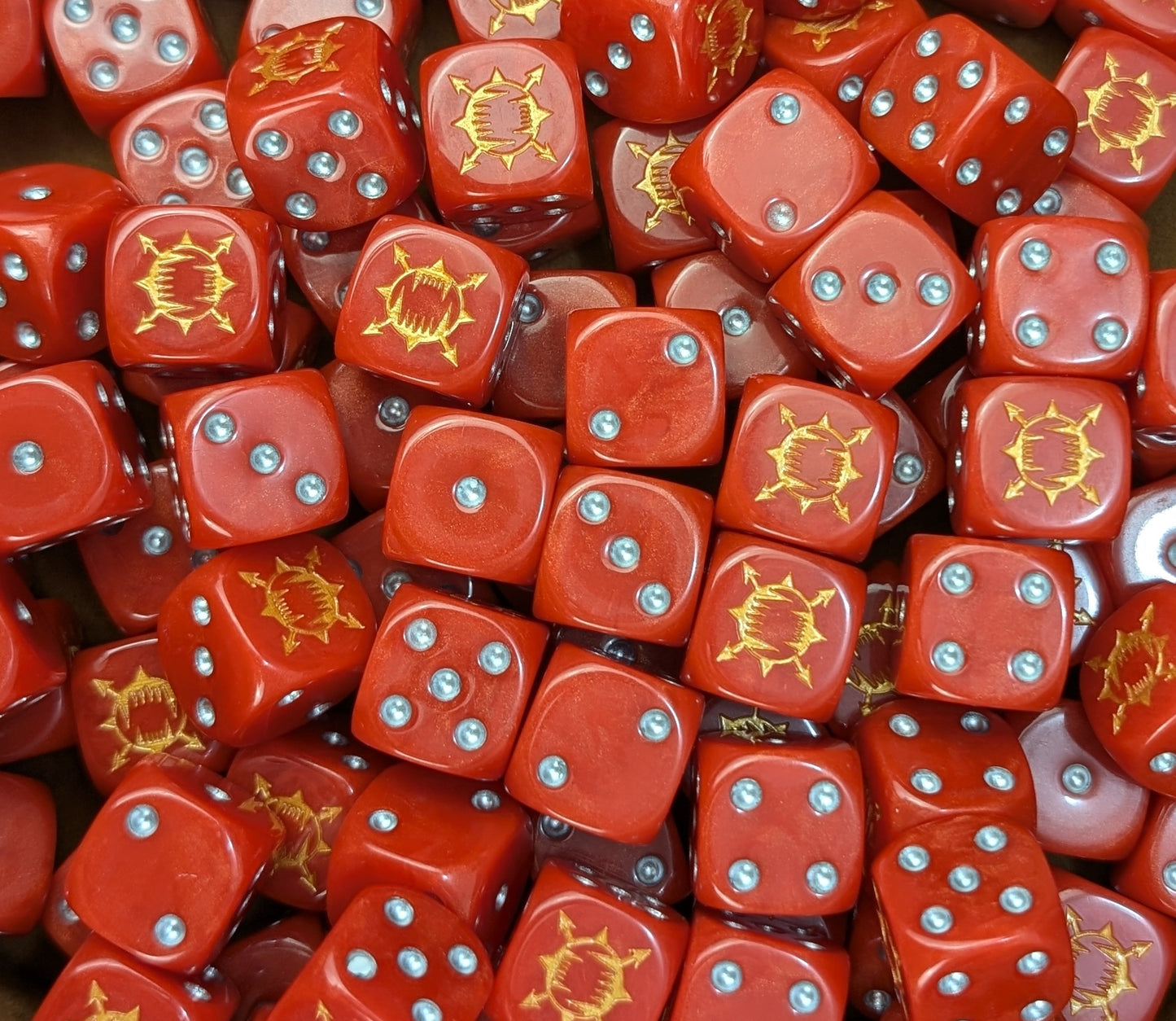 Custom red and brass dice for Warhammer World Eaters forces