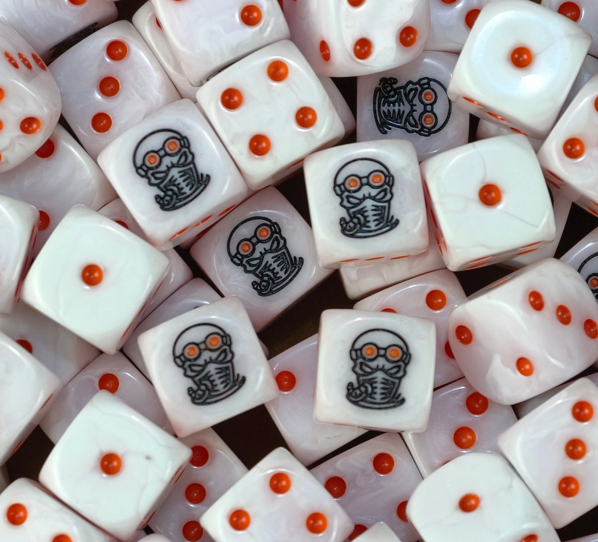 A pile of pink Genestealer Cult dice with orange pips and masked heads