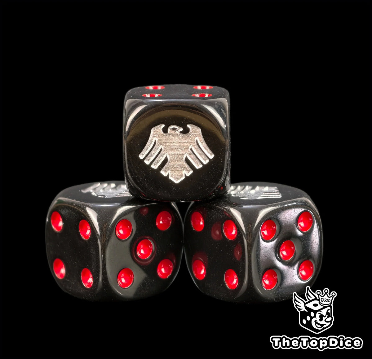 Three black 16mm Raven Guard D6, the silver raven facing front beside red pips