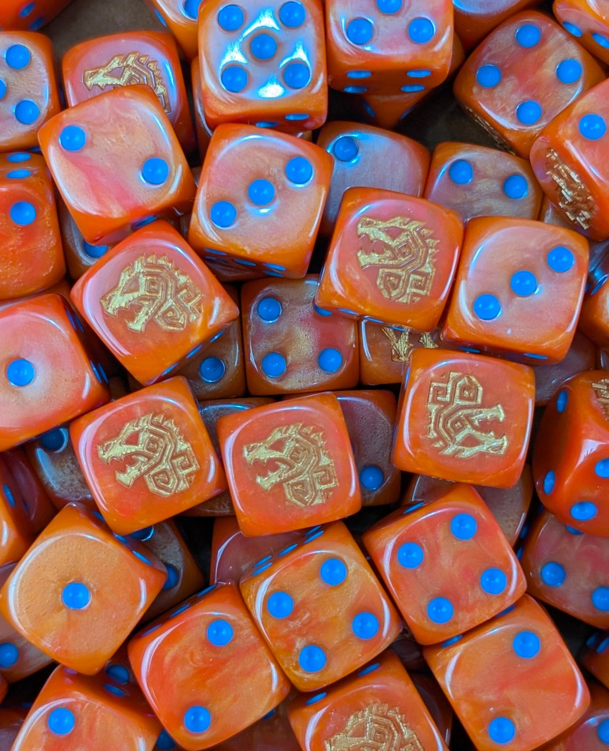Pile of orange dino rune 16mm D6 dice for a fantasy lizardmen army