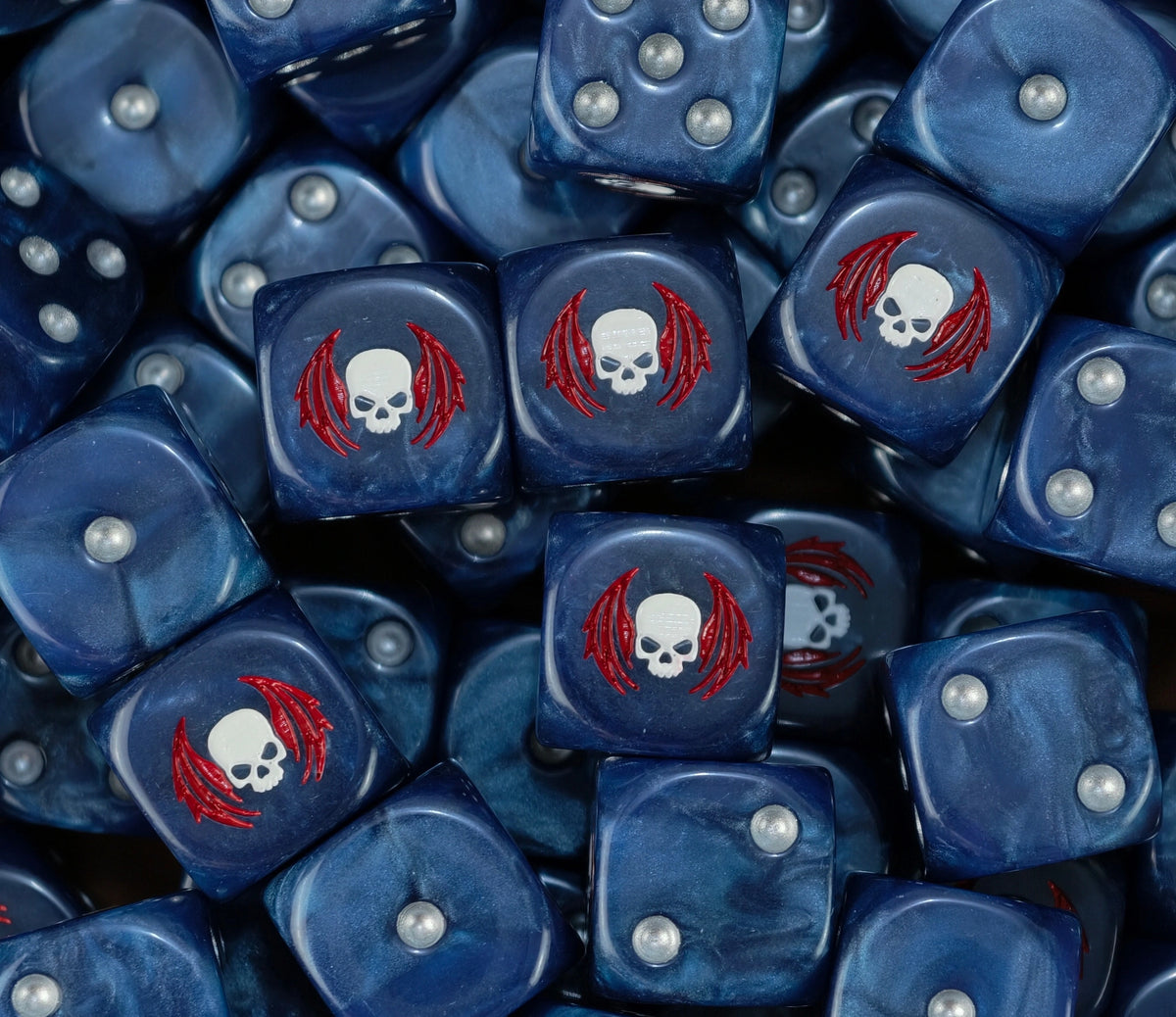 A pile of steel blue Night Lords D6 with pearl pips and sigils