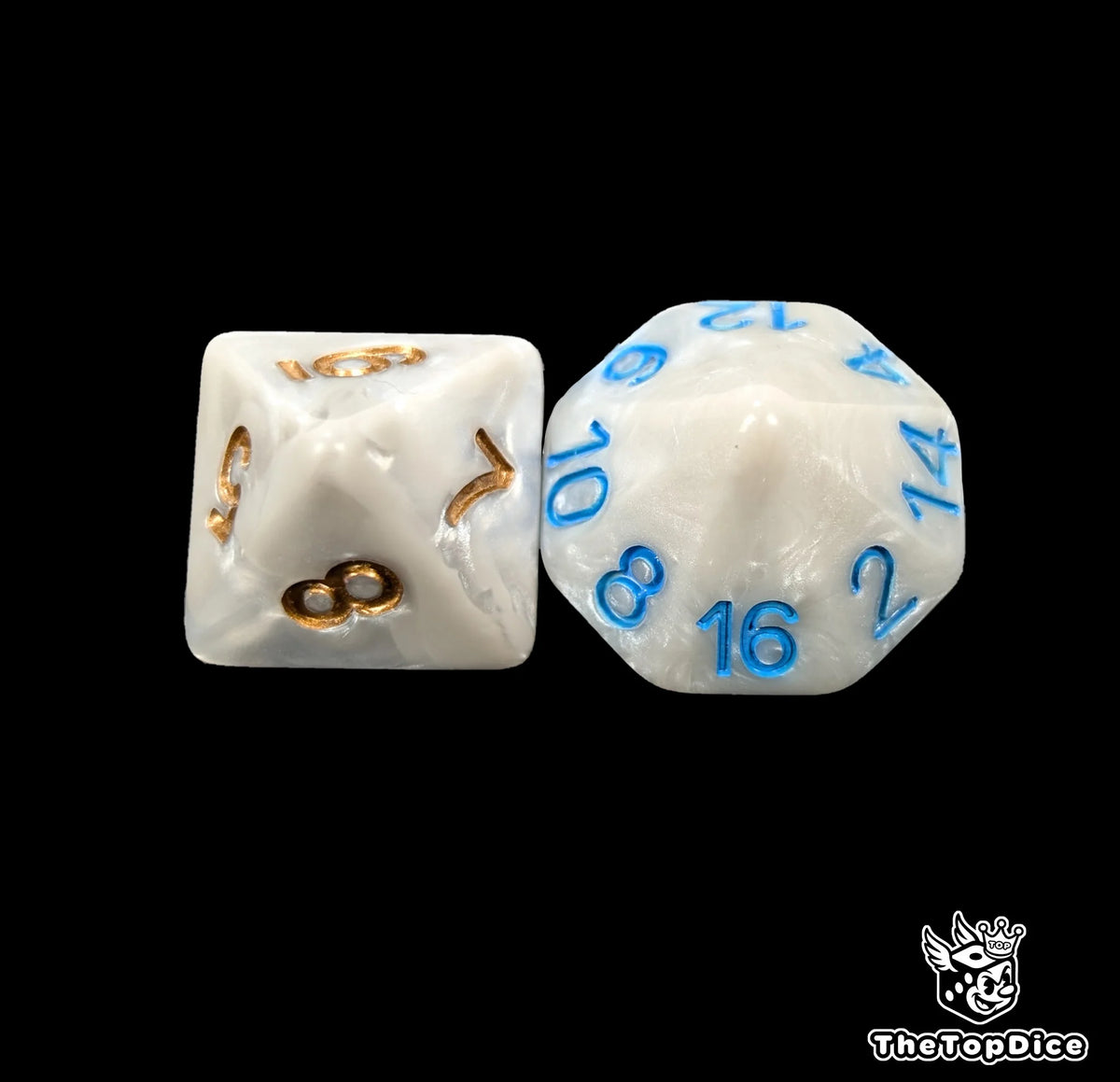 Close up of the bone white 16mm D8 and D16 with bronze numbers from the Pharaoh Skeleton Kings Blood Bowl dice set