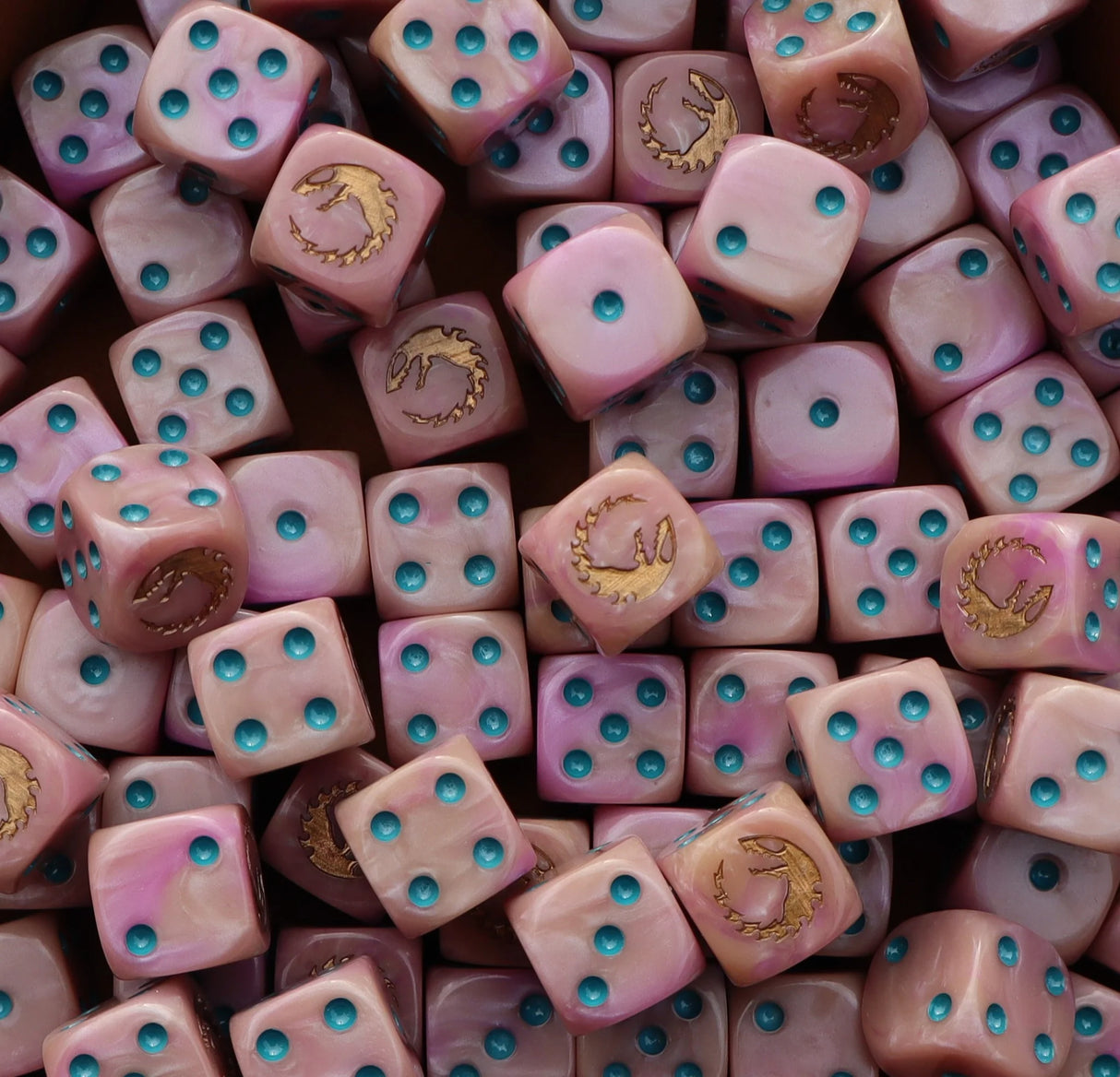 Pile of pink 16mm D6 dice with gold hive sigils for a sci-fi brood army
