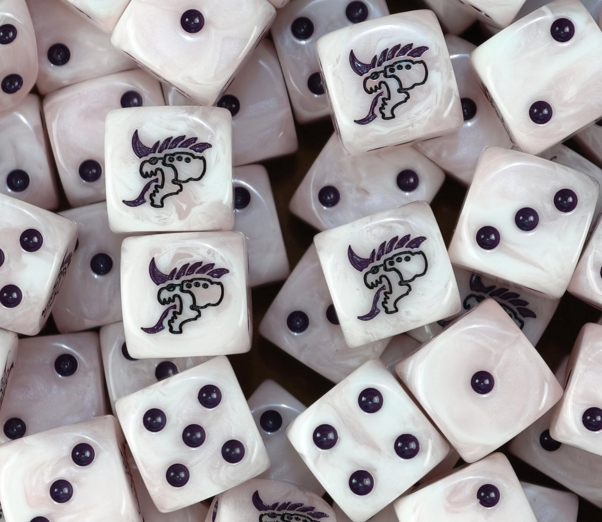 A pile of pale Tyranid dice with purple pips and barbed tongue heads
