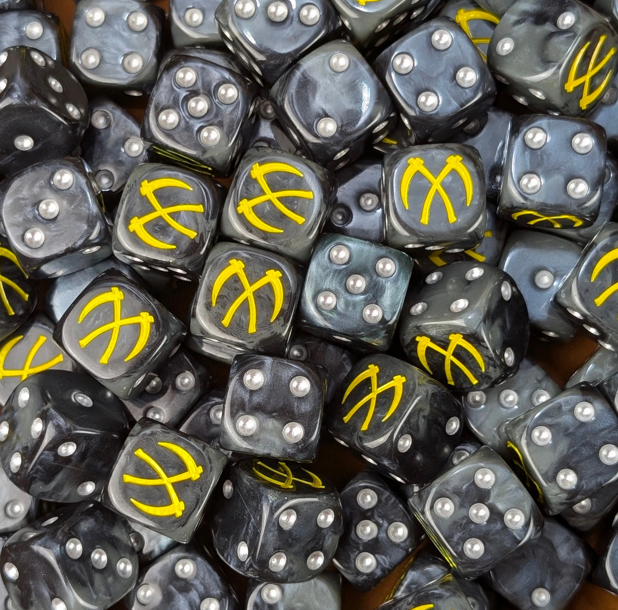 Black 16mm resin D6 dice engraved with crossed yellow scythes and silver pips for sci-fi knight armies