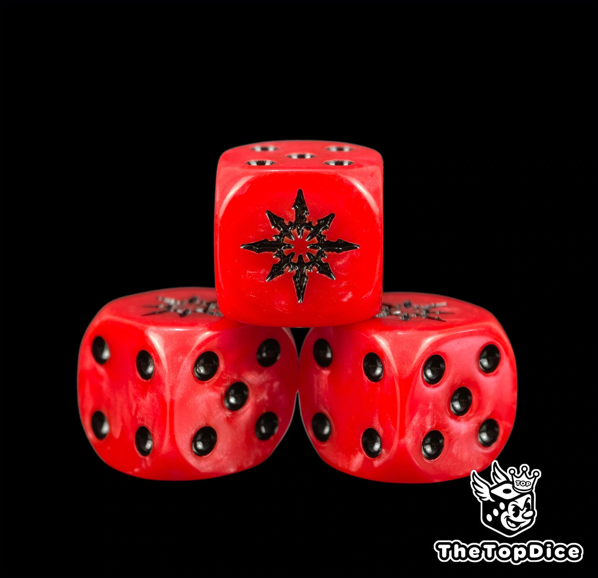 Three red chaos dice with a black eight pointed star on top