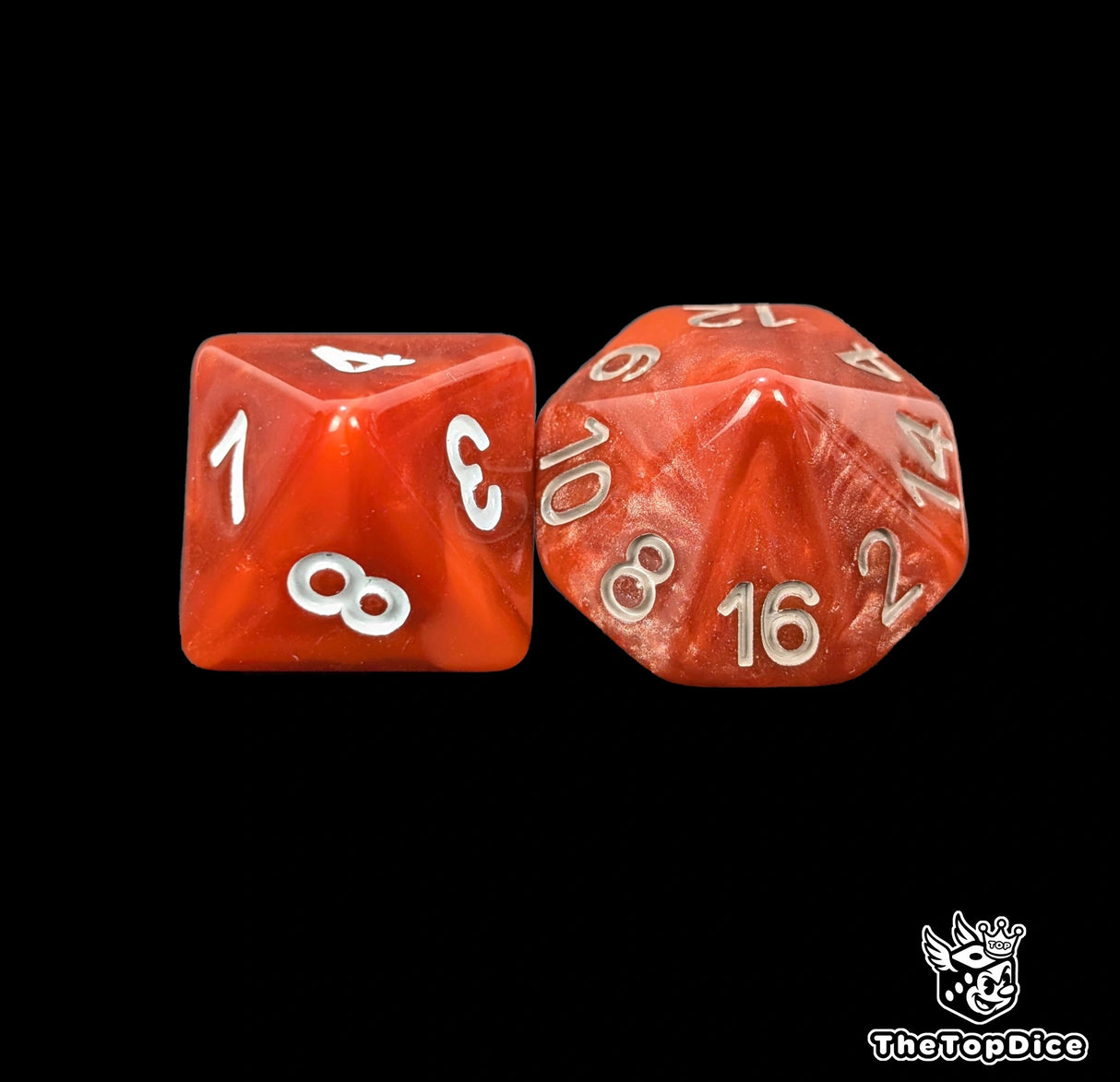Close up of a red D8 and D16 with white numbers for scatter and long range rolls