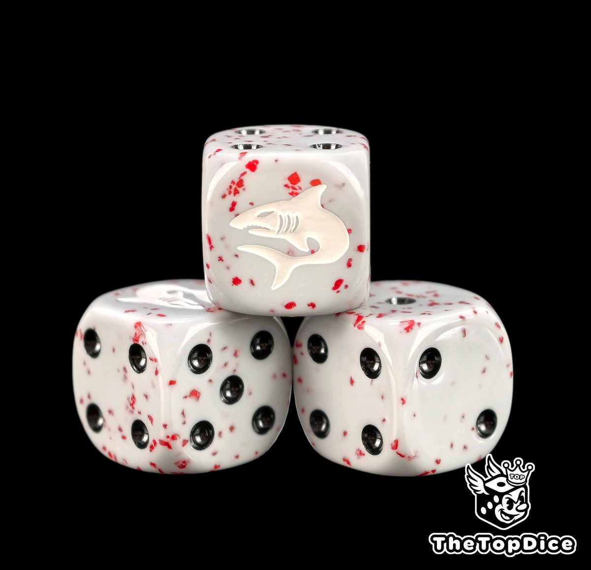 Three grey space shark dice with red spatter and black pips