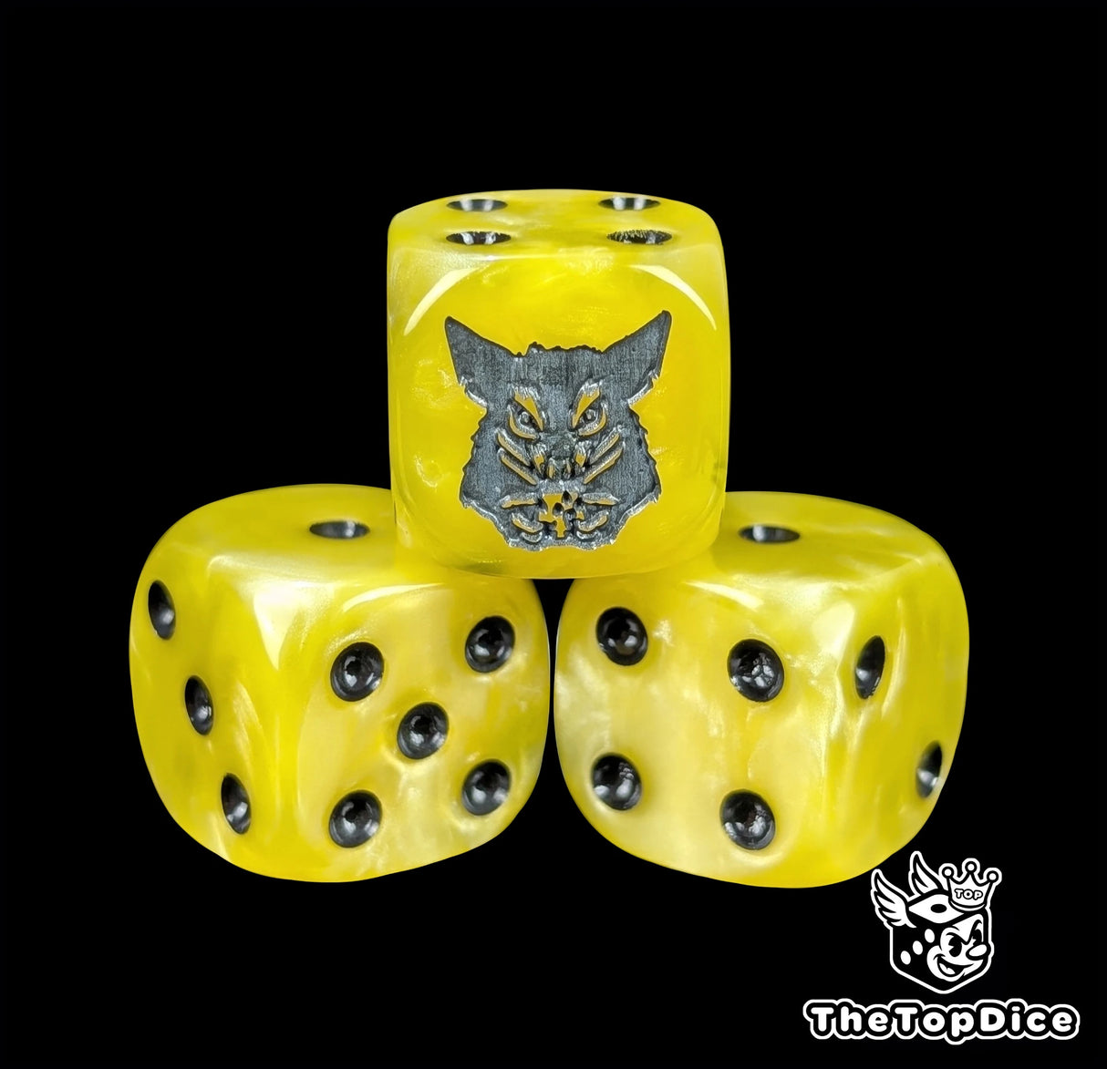 Close-up of a yellow D6 die with a grey rat holding cheese
