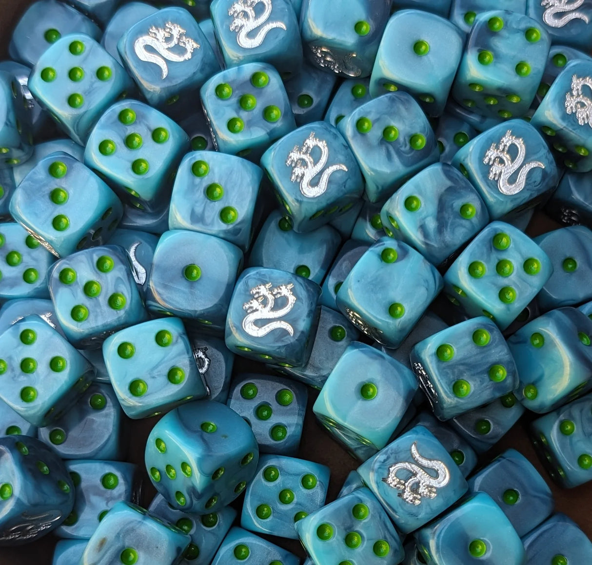 Pile of turquoise hydra 16mm D6 dice for a sci-fi chaos army
