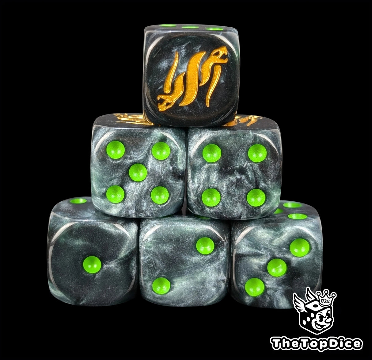 Black resin D6 dice with a gold twin serpent emblem and green pips