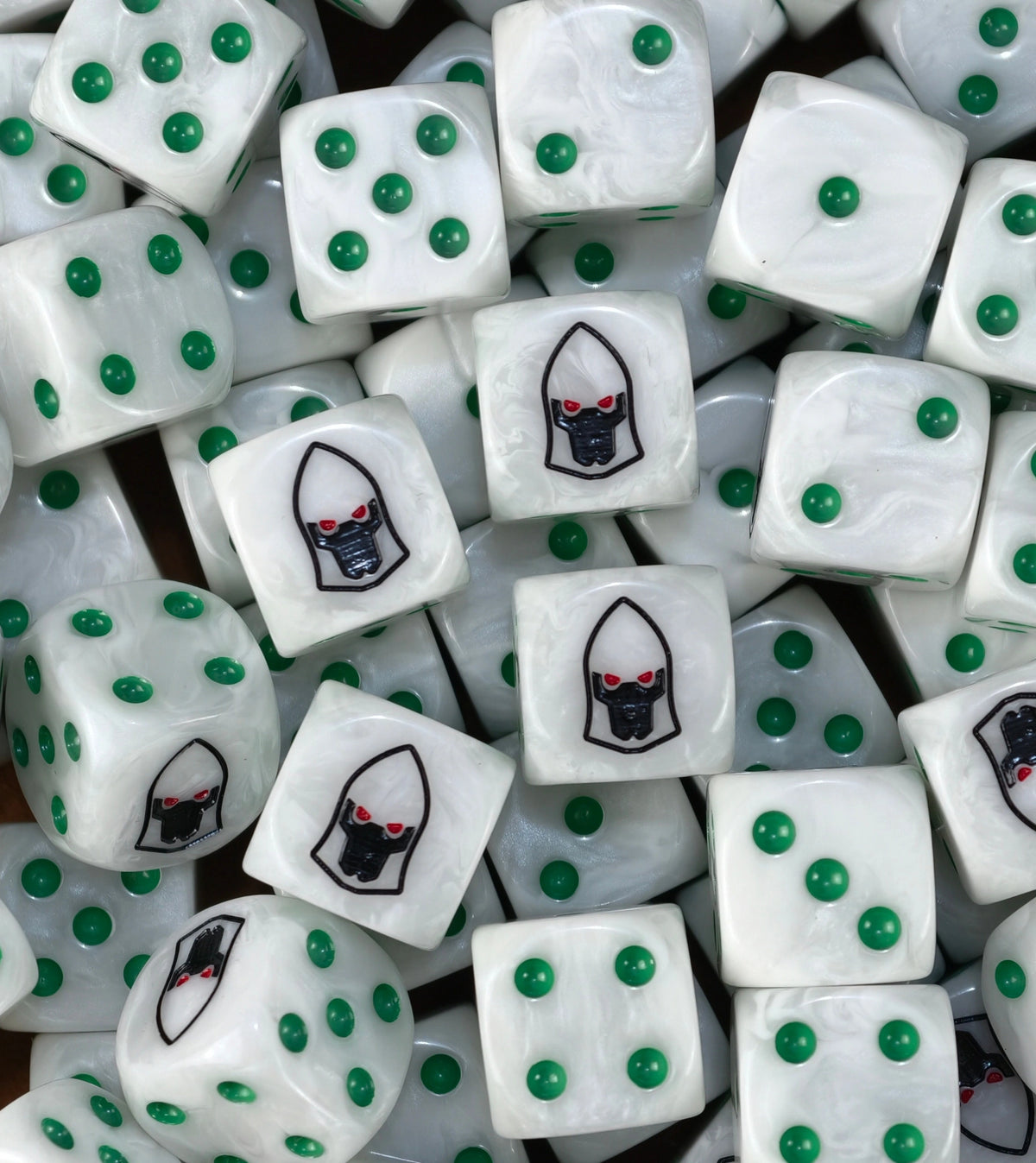 A pile of pearl white Biel-Tan dice with green pips and black helms