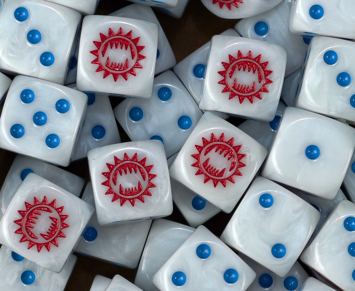 Legion dice for Horus Heresy heaped deep, red maws and blue pips on show