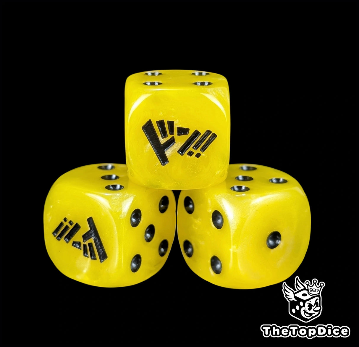 Close up of a yellow 16mm resin D6 die engraved with black pips as a TCG power counter
