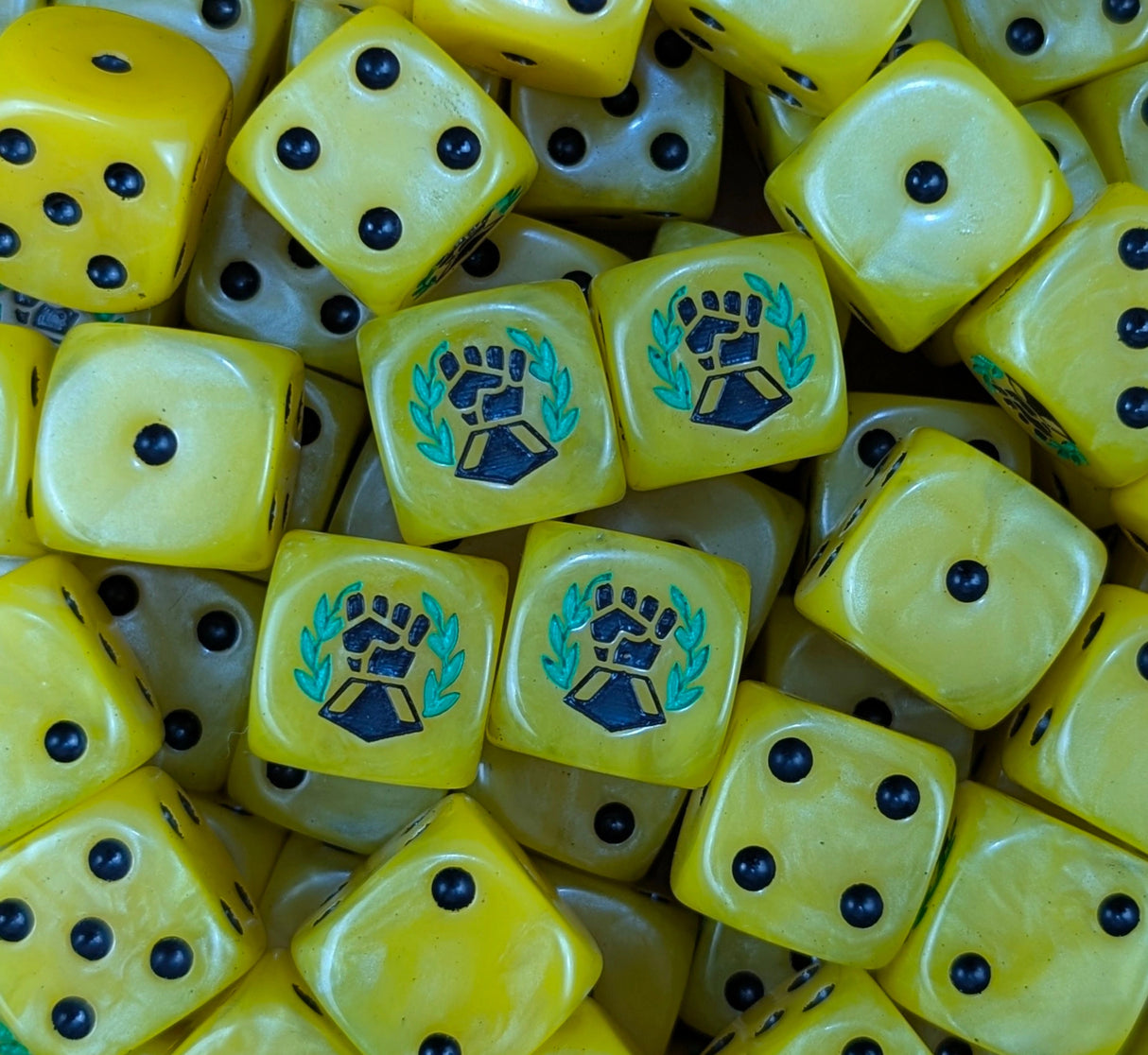 Pile of yellow laurel fist 16mm D6 dice for a sci-fi marine army