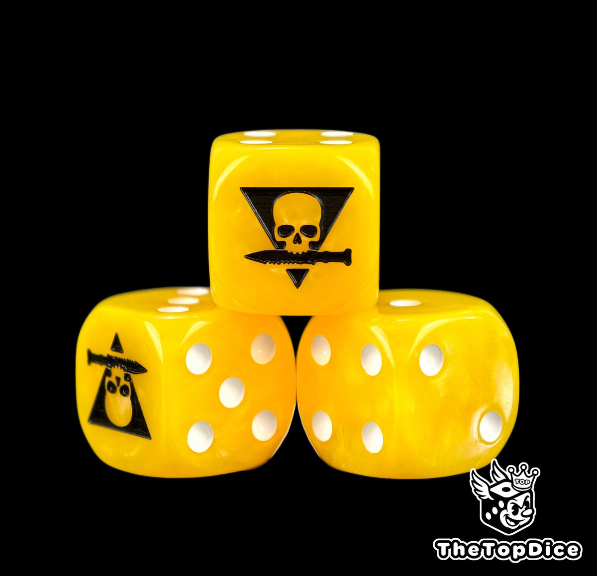 Three yellow kill team dice with a black skull over a knife