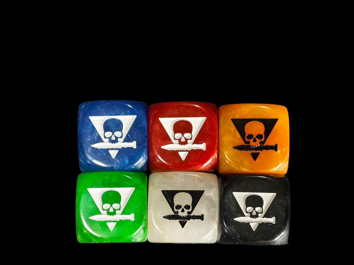 Six 16mm resin D6 in blue, red, orange, green, bone and black, each showing an engraved skull emblem