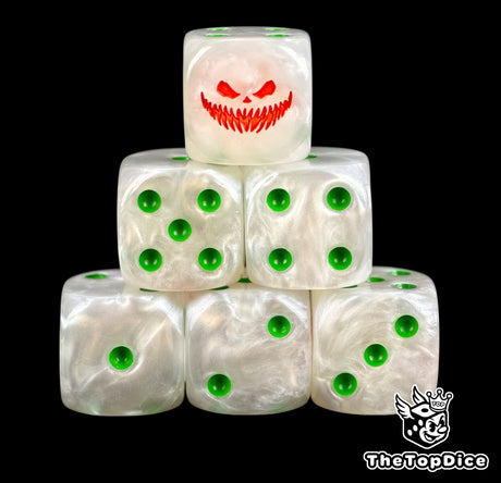 Close up of two ghost white D6 with a red pumpkin grin on the six face and green pips