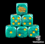 Close up of two turquoise D6 with a gold feathered serpent on the six face and gold pips