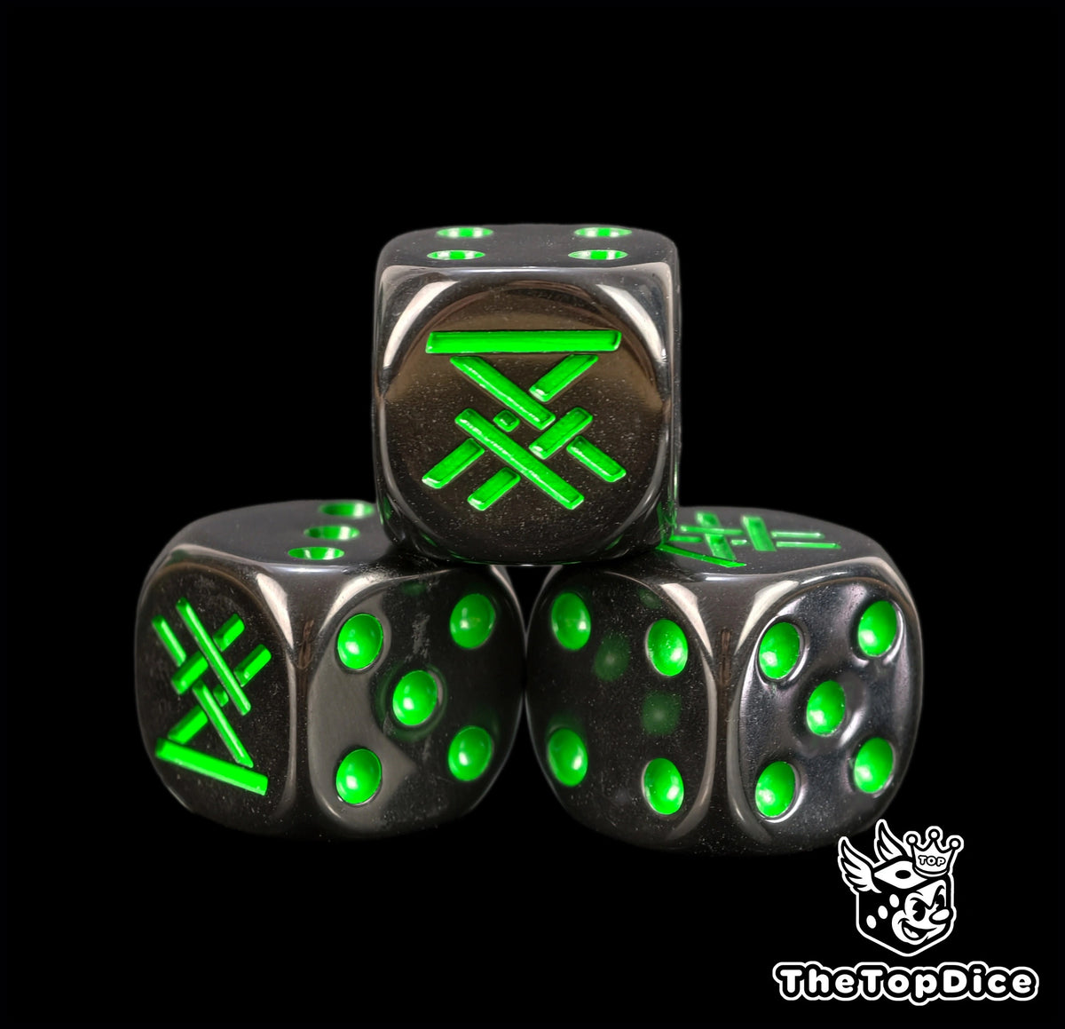 Three black 16mm ratfolk D6, the green Skaven rune facing front beside green pips