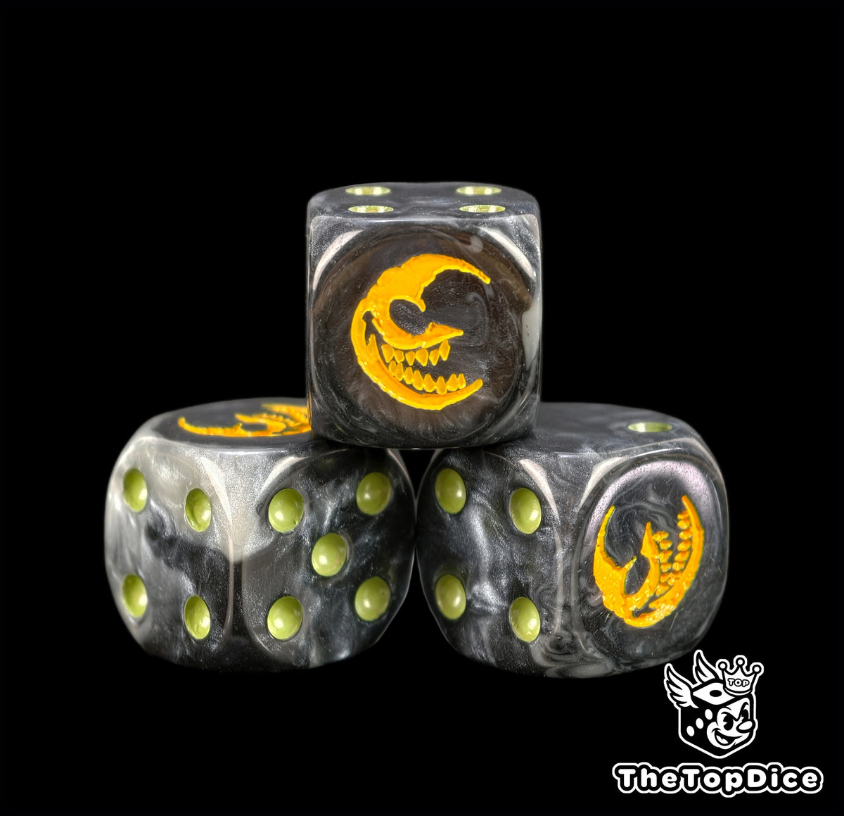 Three black 16mm Gloomspite Gitz D6, the yellow mad moon facing front beside olive pips