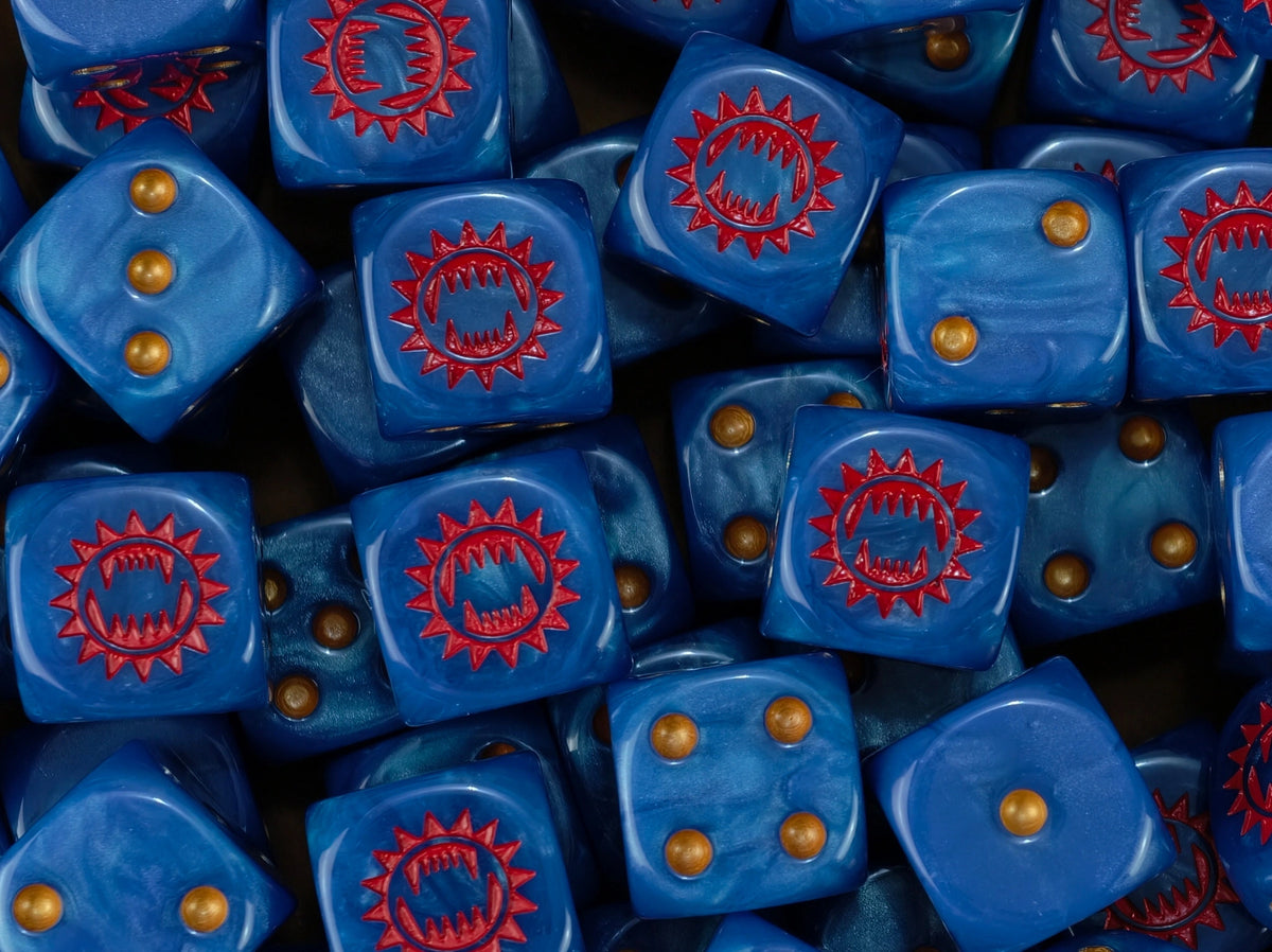 Pile of blue heresy era World Eaters dice showing the red maw and the gold pips