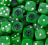 Pile of green Sons of Medusa dice showing the black cog skull and the white pips