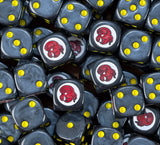 A pile of black Red Scorpions dice, red scorpion badges and yellow pips repeating