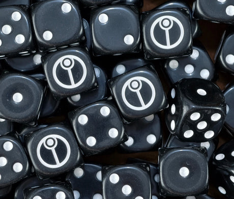 Full pack of black and white T'au Empire dice arranged on a dark surface