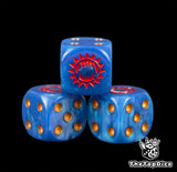 Close view of the red fanged maw engraved on a dark blue 16mm D6 with gold pips