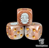 Close-up of a bronze D6 die with a white sky dwarf emblem