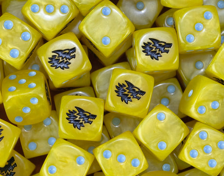 A pile of yellow Space Wolves dice with ice blue pips and wolf heads