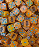 Pile of orange tech dwarf 16mm D6 dice for a sci-fi dwarf army